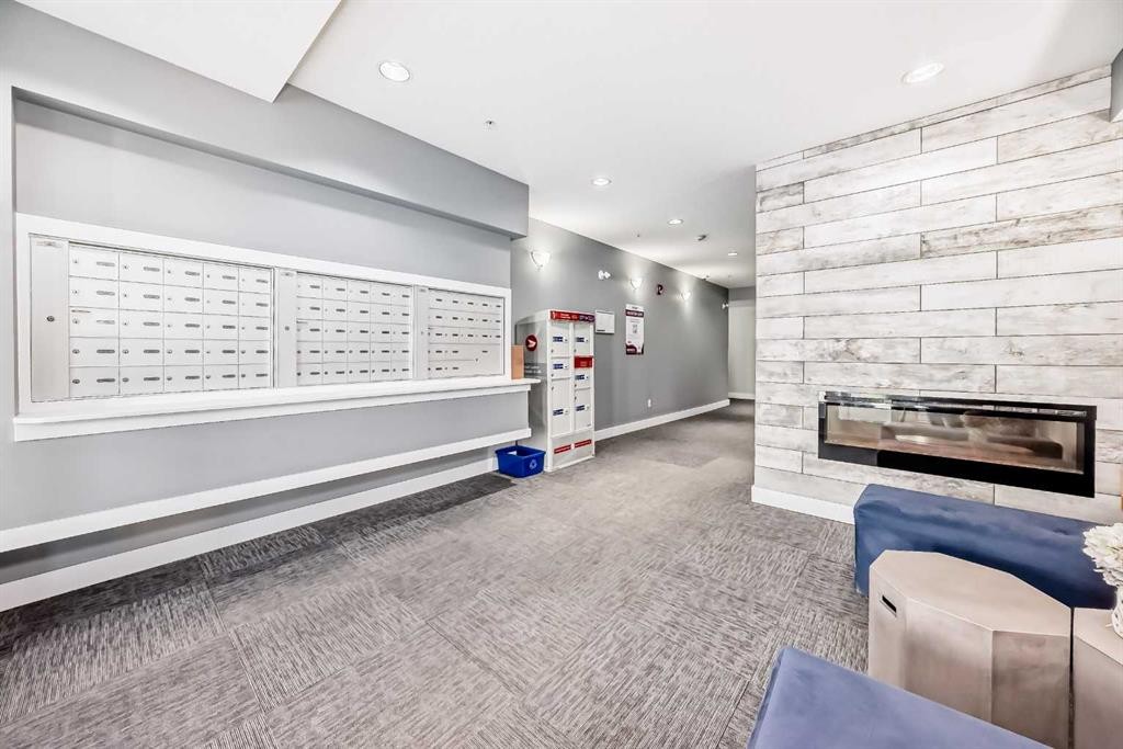 1212-3727 Sage Hill Drive Nw, Calgary, AB - Indoor With Fireplace