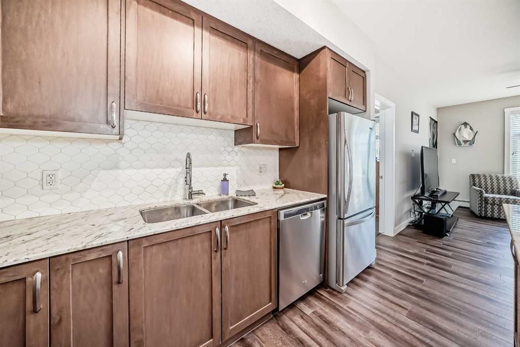 1212-3727 Sage Hill Drive Nw, Calgary, AB - Indoor Photo Showing Kitchen With Stainless Steel Kitchen With Double Sink