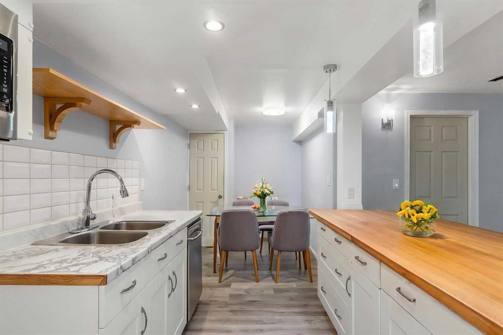 630 69 Avenue Sw, Calgary, AB - Indoor Photo Showing Kitchen With Double Sink