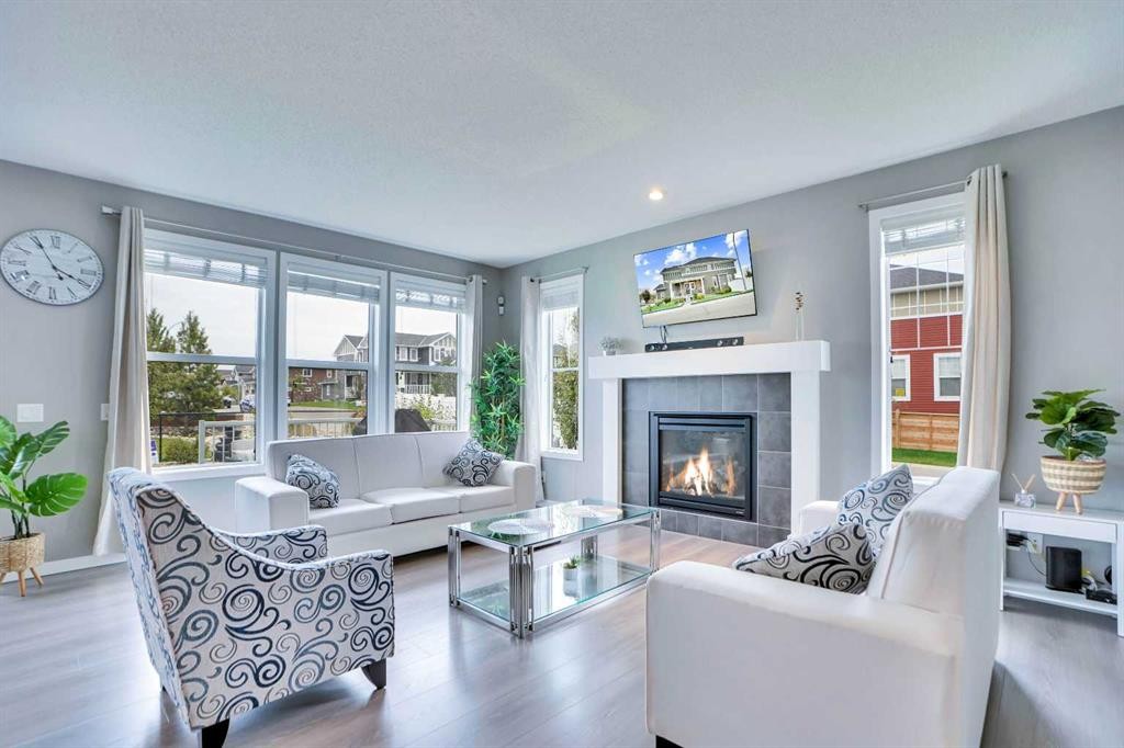 100 Redstone Parade Ne, Calgary, AB - Indoor Photo Showing Living Room With Fireplace