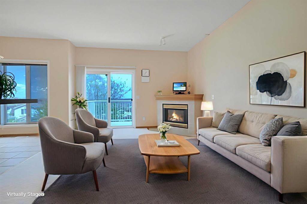 78 Hamptons Link Nw, Calgary, AB - Indoor Photo Showing Living Room With Fireplace