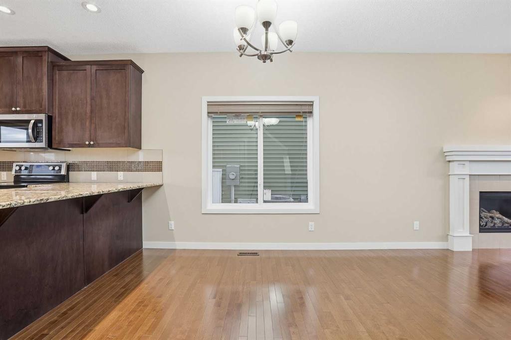 37 Nolanfield Manor Nw, Calgary, AB - Indoor Photo Showing Kitchen With Fireplace