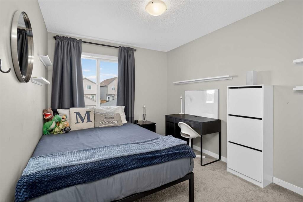257 Cranford Park Se, Calgary, AB - Indoor Photo Showing Bedroom