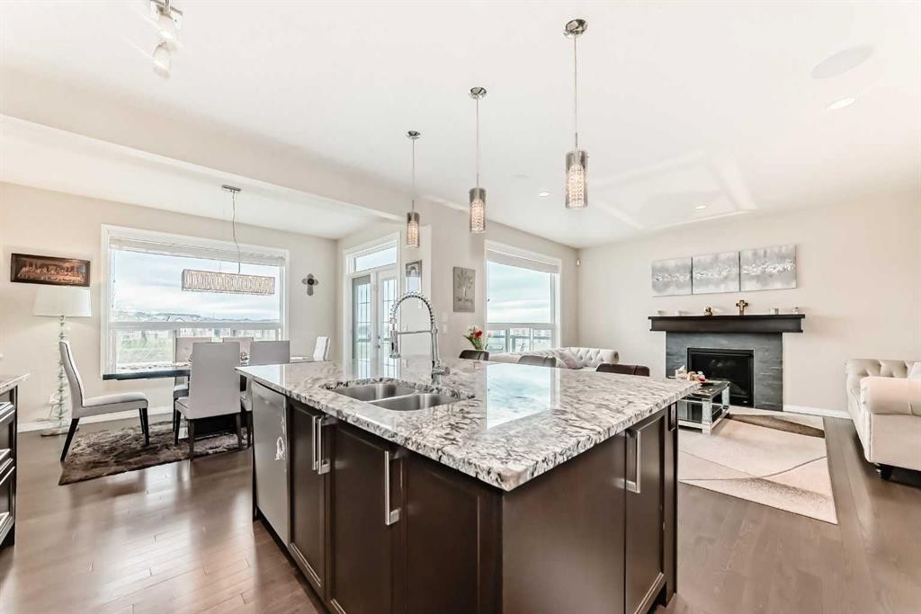 91 Nolanfield Crescent Nw, Calgary, AB - Indoor Photo Showing Kitchen With Fireplace With Double Sink With Upgraded Kitchen