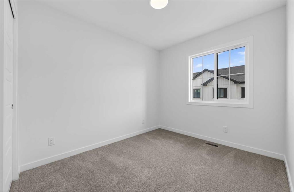 56 Creekside Drive Sw, Calgary, AB - Indoor Photo Showing Other Room