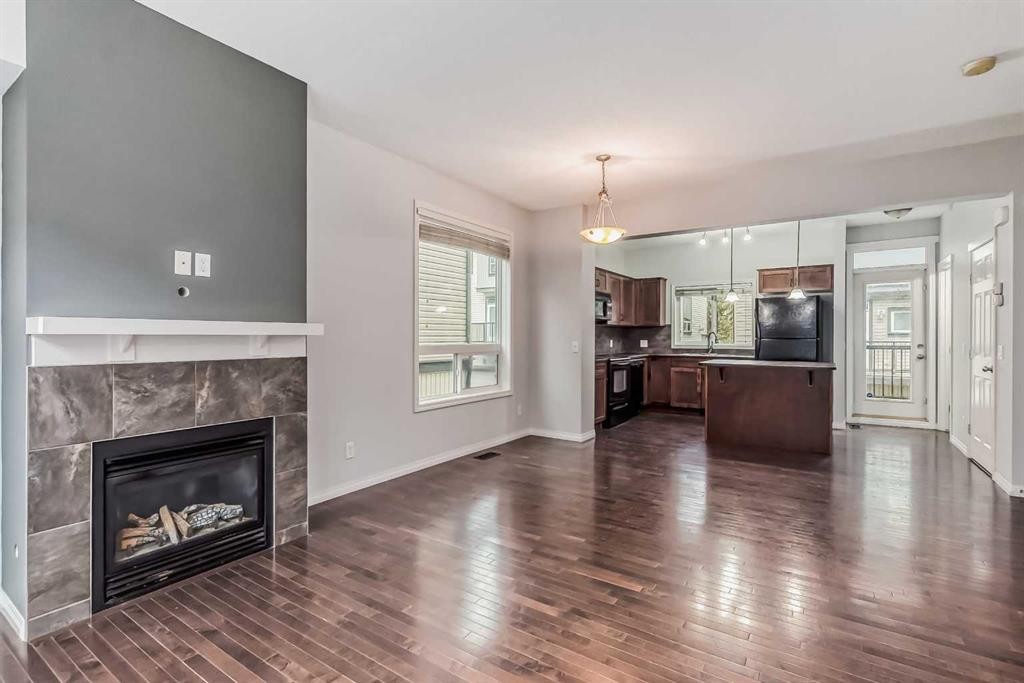 219 Kincora Lane Nw, Calgary, AB - Indoor Photo Showing Living Room With Fireplace