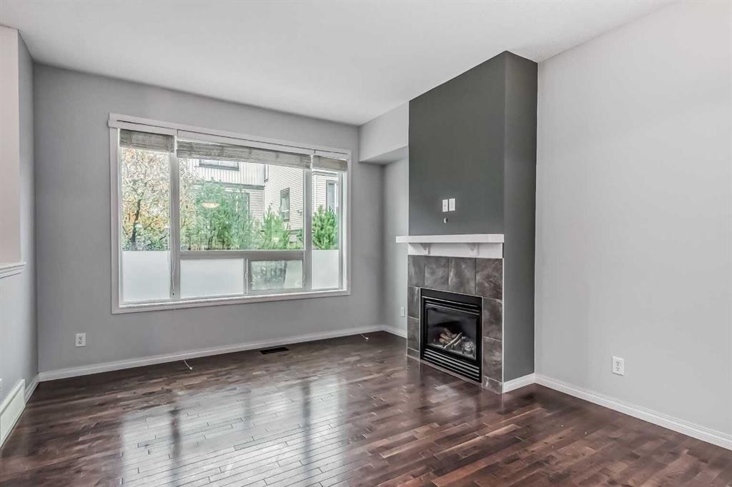 219 Kincora Lane Nw, Calgary, AB - Indoor Photo Showing Living Room With Fireplace