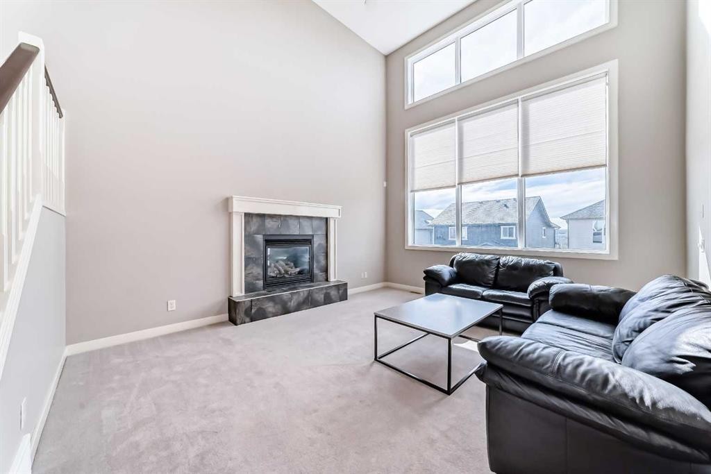 455 Hidden Creek Boulevard Nw, Calgary, AB - Indoor Photo Showing Living Room With Fireplace