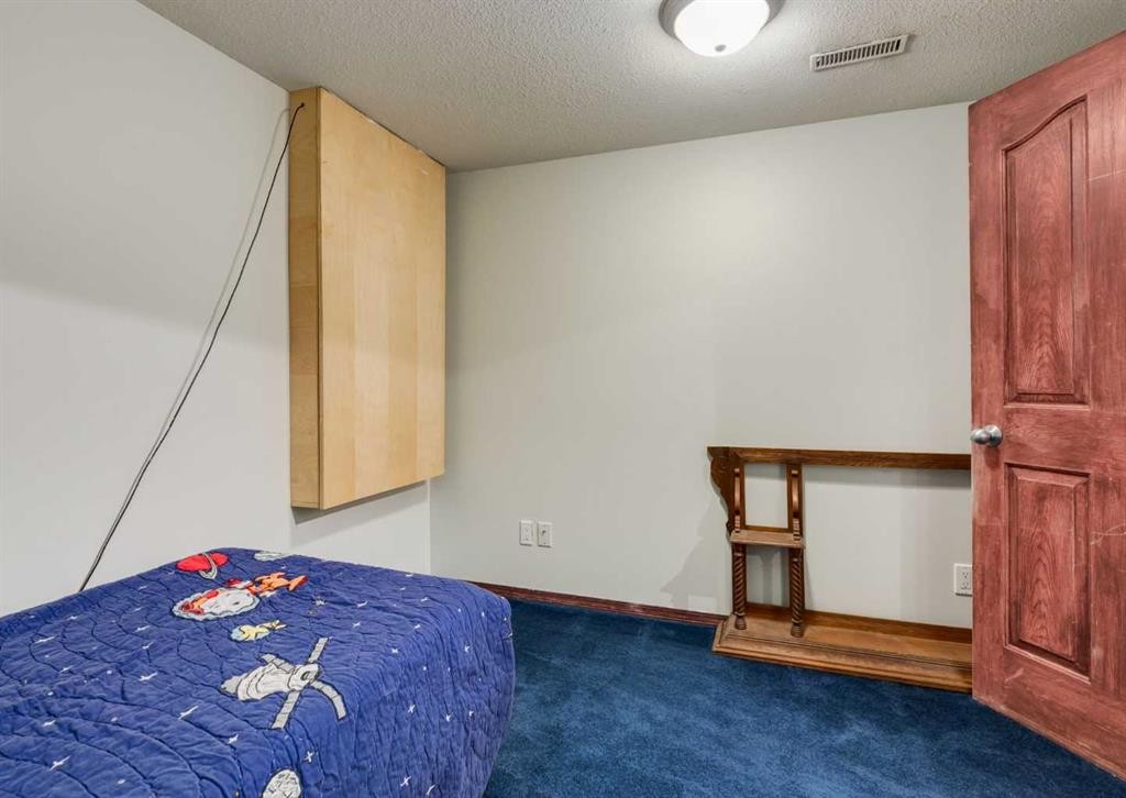 244 Stonegate Close Nw, Airdrie, AB - Indoor Photo Showing Bedroom