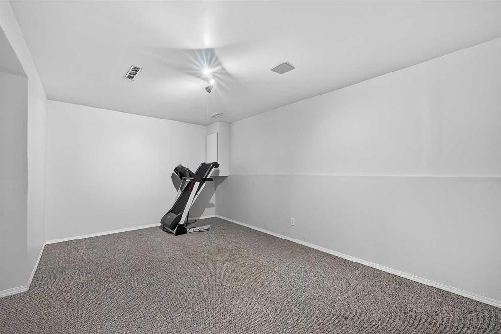 7-14736 Deerfield, Calgary, AB - Indoor Photo Showing Gym Room