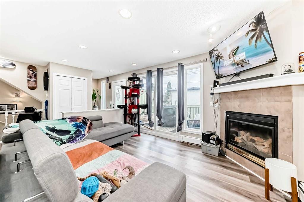 1-6-8 Huntley Close Ne, Calgary, AB - Indoor Photo Showing Living Room With Fireplace