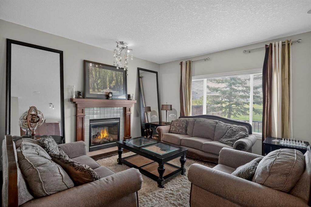 32 Evanspark Circle Nw, Calgary, AB - Indoor Photo Showing Living Room With Fireplace