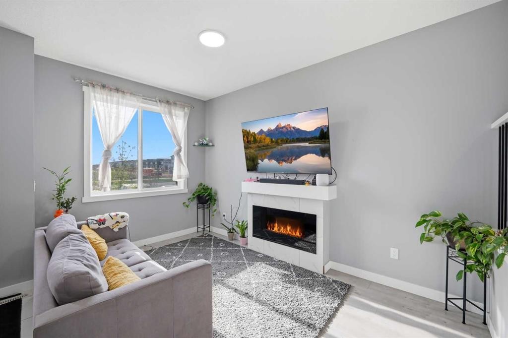 668 Cornerstone Boulevard Ne, Calgary, AB - Indoor Photo Showing Living Room With Fireplace