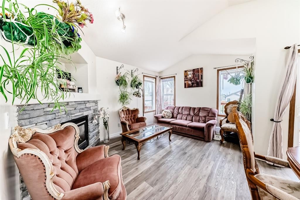 92 Everstone Rise Sw, Calgary, AB - Indoor Photo Showing Living Room With Fireplace