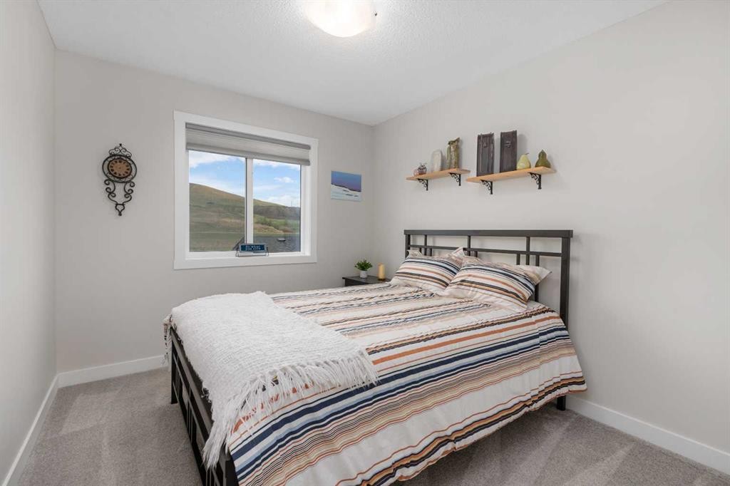 315 Wolf Creek Way Se, Calgary, AB - Indoor Photo Showing Bedroom