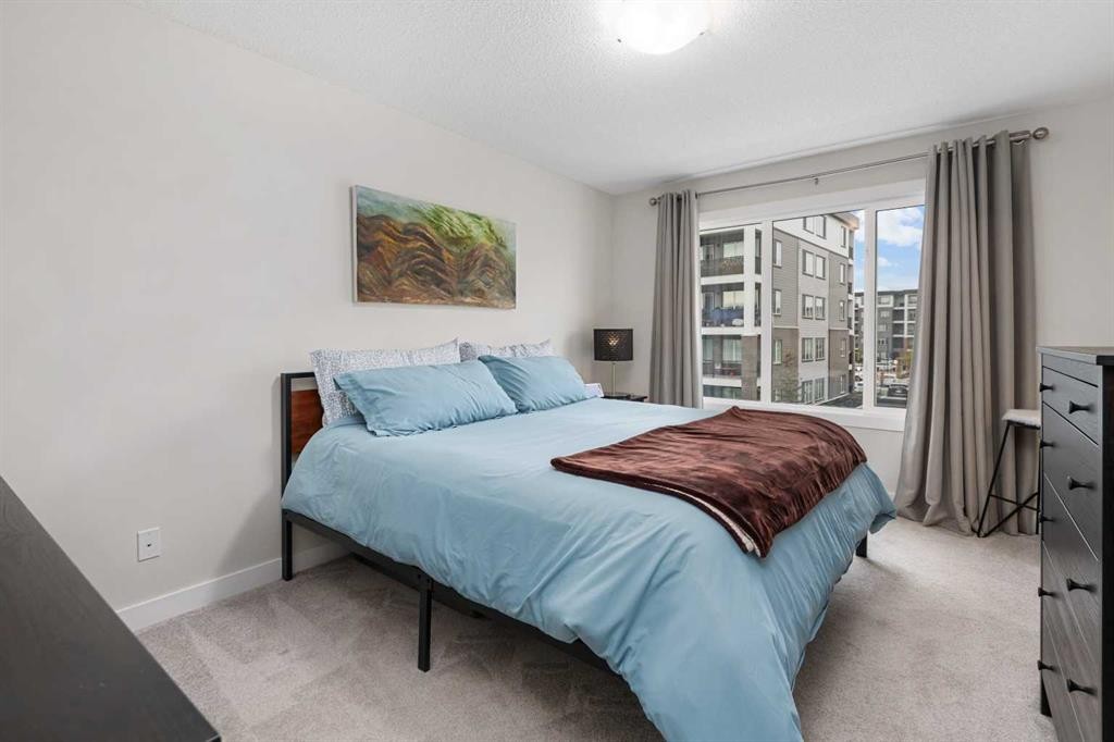 315 Wolf Creek Way Se, Calgary, AB - Indoor Photo Showing Bedroom