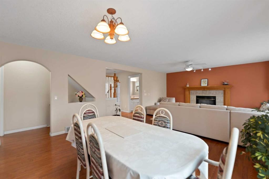 434 Douglas Woods Mews Se, Calgary, AB - Indoor Photo Showing Dining Room With Fireplace