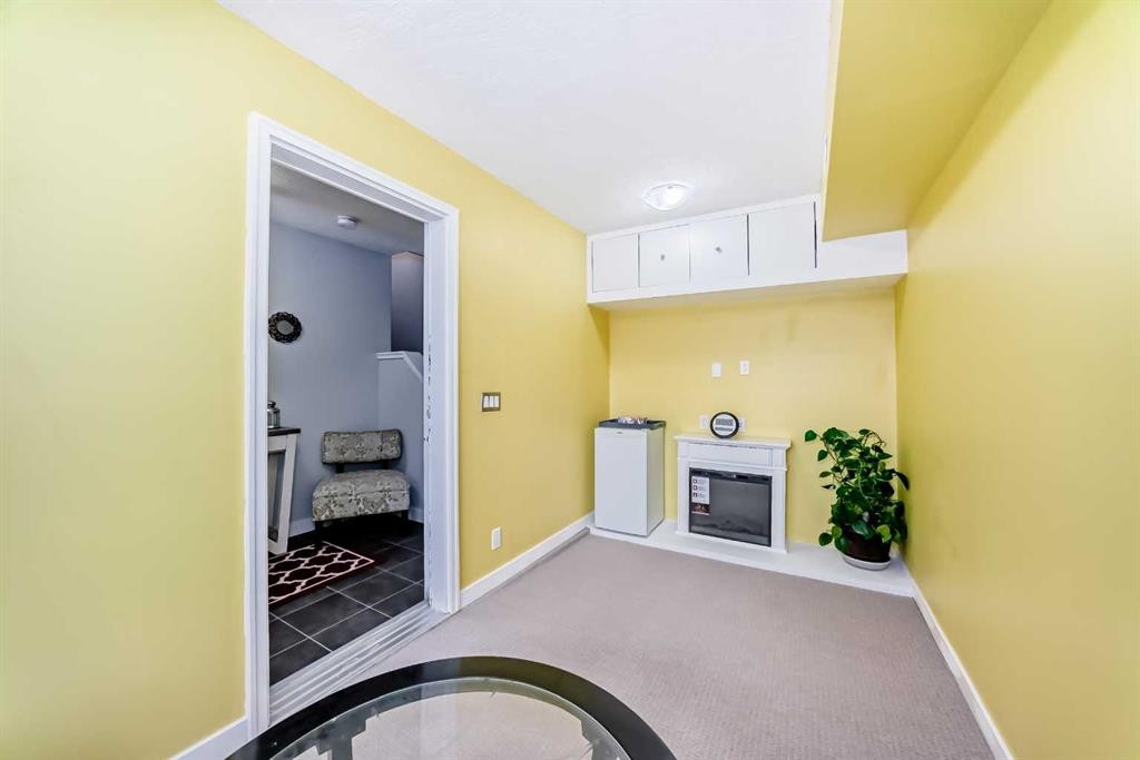 109 Redstone Circle Ne, Calgary, AB - Indoor Photo Showing Other Room With Fireplace