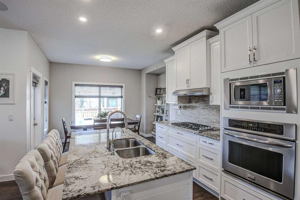 29 Drake Landing Loop, Okotoks, AB - Indoor Photo Showing Kitchen With Stainless Steel Kitchen With Double Sink With Upgraded Kitchen