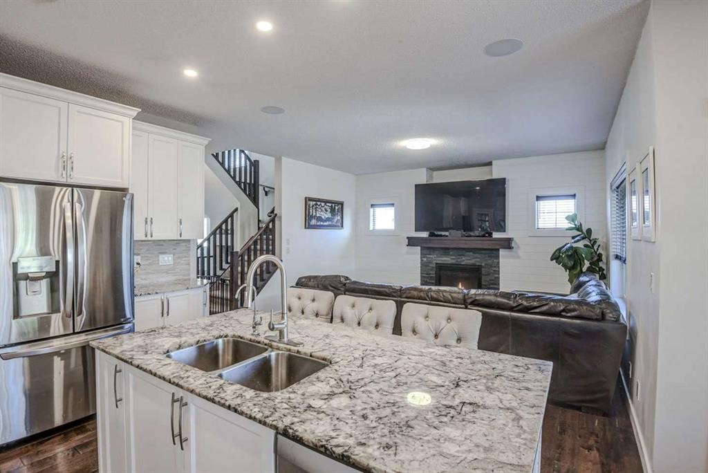 29 Drake Landing Loop, Okotoks, AB - Indoor Photo Showing Kitchen With Stainless Steel Kitchen With Double Sink With Upgraded Kitchen