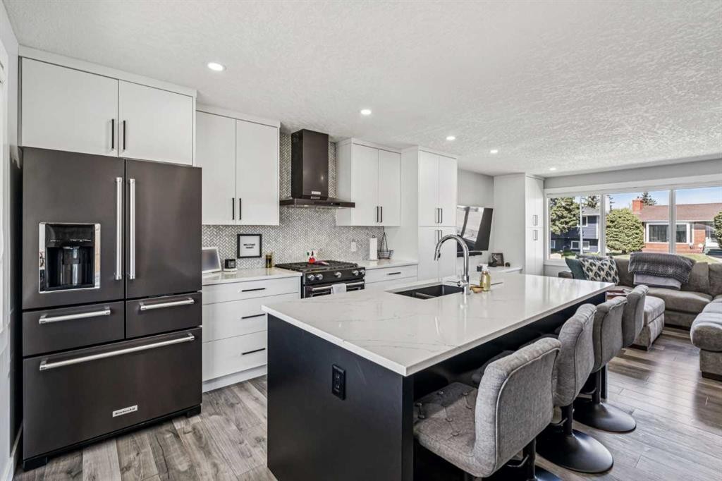 2219 Munro Drive Ne, Calgary, AB - Indoor Photo Showing Kitchen With Stainless Steel Kitchen With Double Sink With Upgraded Kitchen