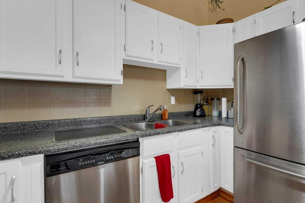 52 Strathclair Rise Sw, Calgary, AB - Indoor Photo Showing Kitchen With Double Sink