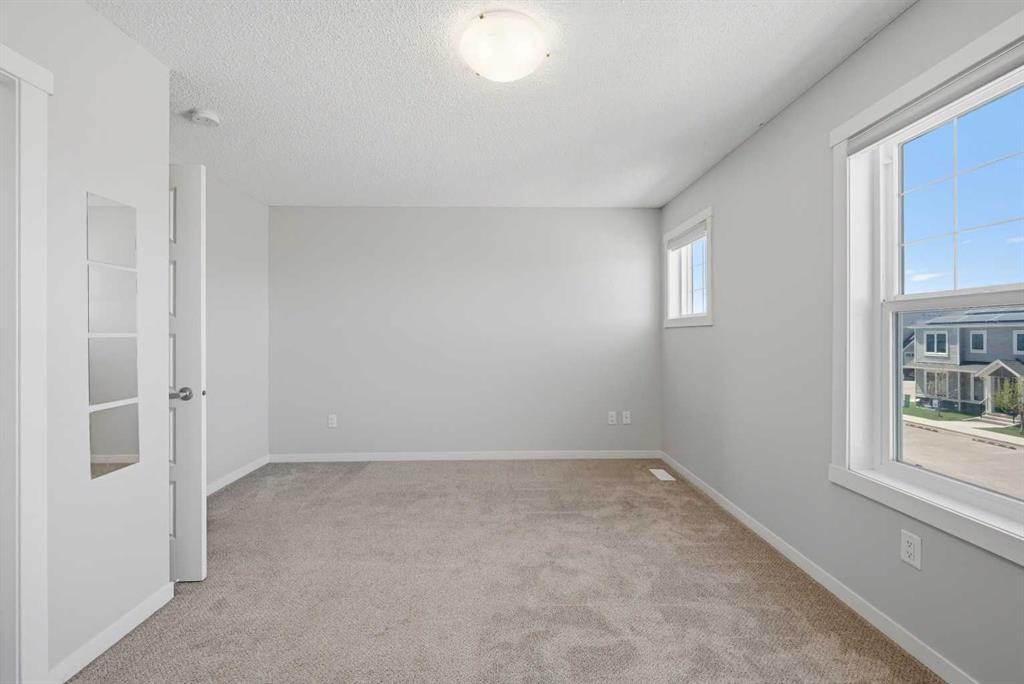 1322-7451 Falconridge Boulevard Ne, Calgary, AB - Indoor Photo Showing Other Room