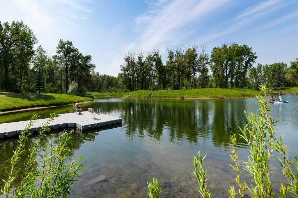 42 River Rock Green Se, Calgary, AB - Outdoor With Body Of Water With View