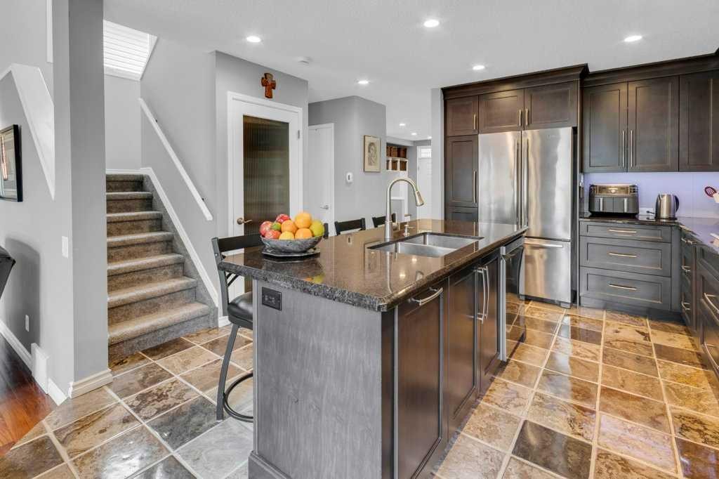 42 River Rock Green Se, Calgary, AB - Indoor Photo Showing Kitchen With Double Sink With Upgraded Kitchen