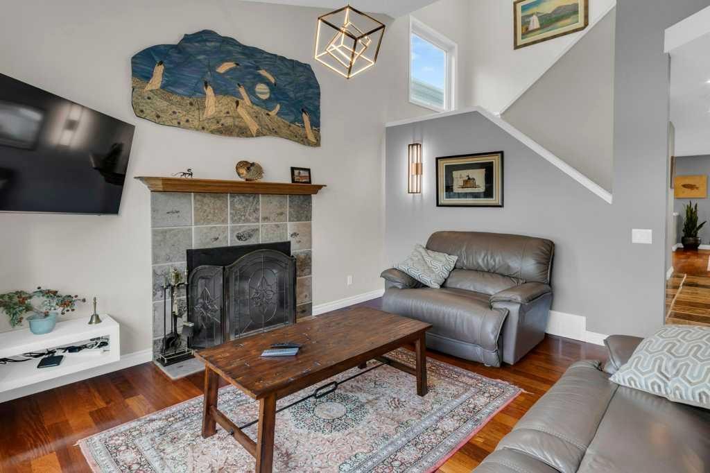 42 River Rock Green Se, Calgary, AB - Indoor Photo Showing Living Room With Fireplace