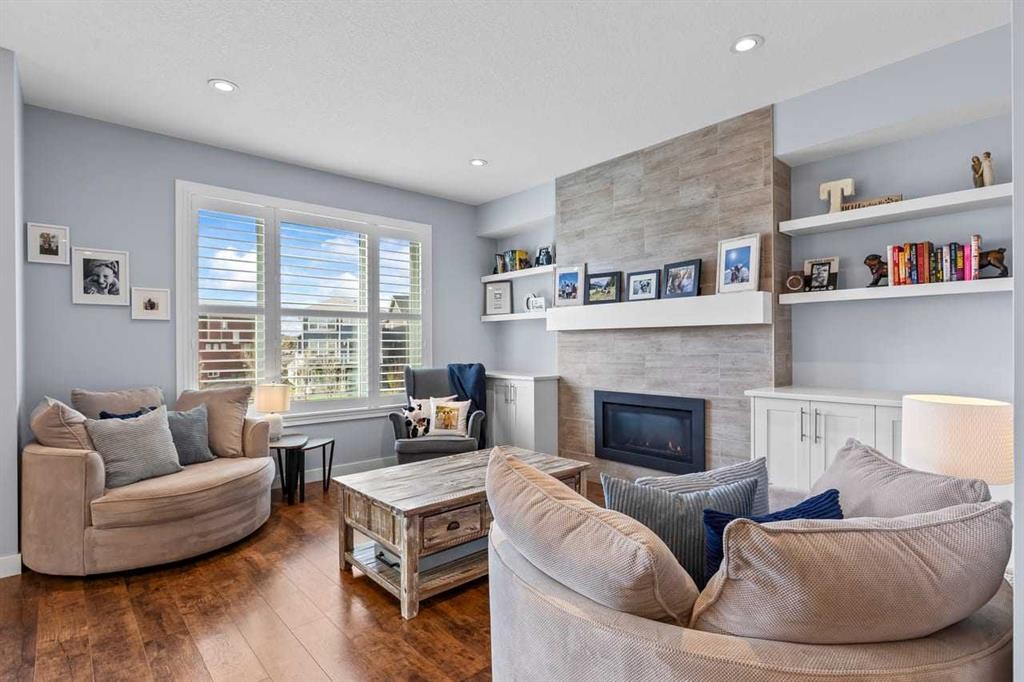 68 Legacy Manor Se, Calgary, AB - Indoor Photo Showing Living Room With Fireplace