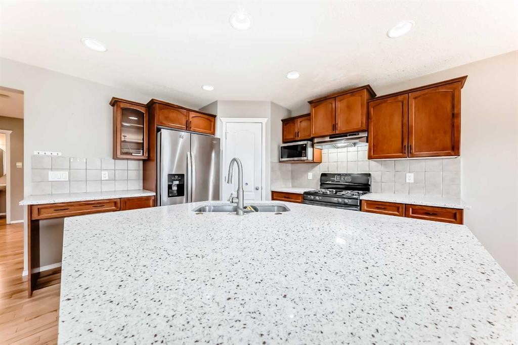 80 Eversyde Way Sw, Calgary, AB - Indoor Photo Showing Kitchen With Double Sink