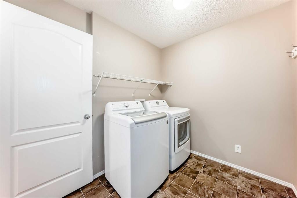 80 Eversyde Way Sw, Calgary, AB - Indoor Photo Showing Laundry Room