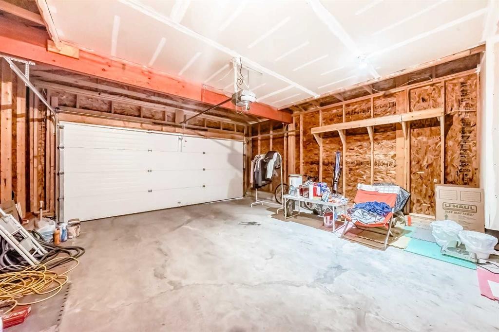 80 Eversyde Way Sw, Calgary, AB - Indoor Photo Showing Garage