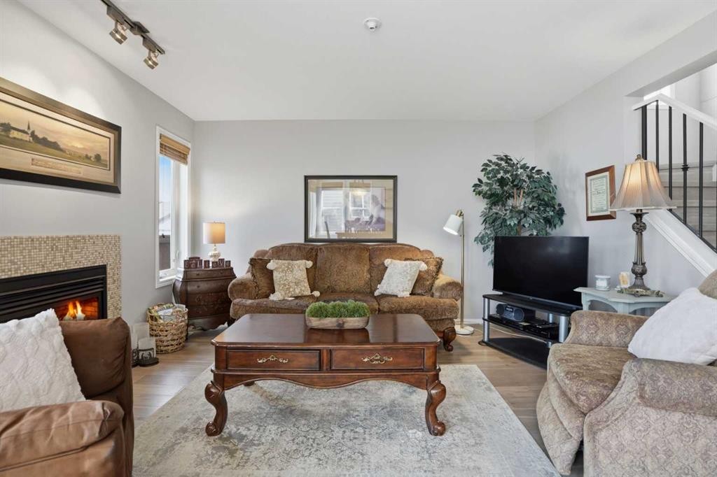 87 Bridlecrest Road Sw, Calgary, AB - Indoor Photo Showing Living Room With Fireplace