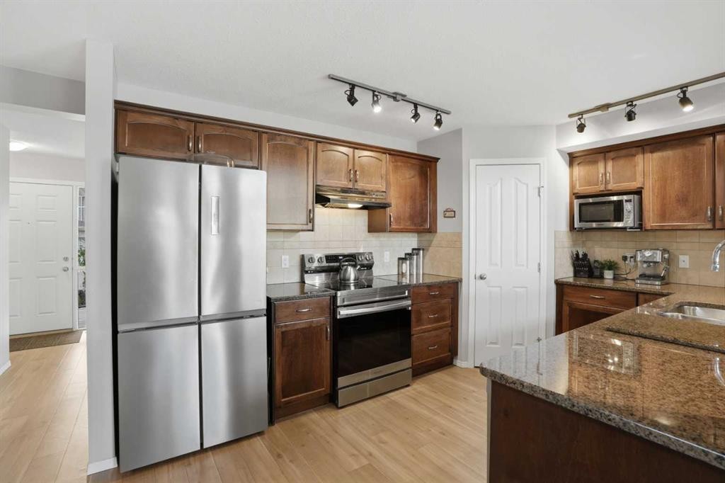 87 Bridlecrest Road Sw, Calgary, AB - Indoor Photo Showing Kitchen With Stainless Steel Kitchen