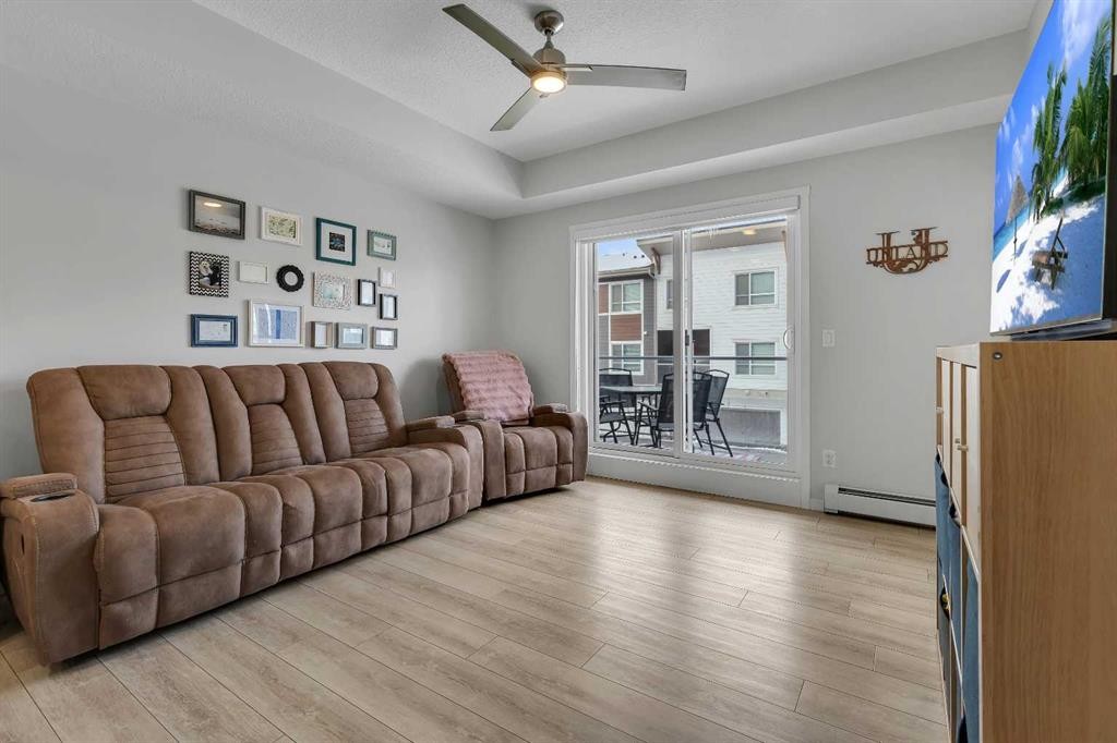 206-370 Harvest Hills Common Ne, Calgary, AB - Indoor Photo Showing Living Room