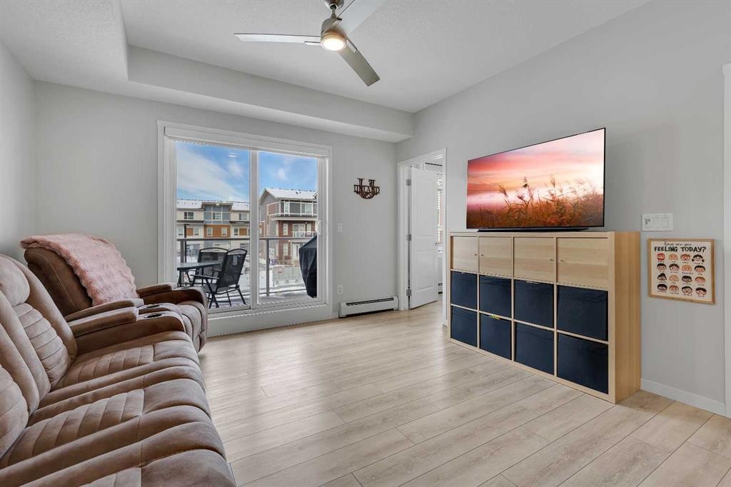 206-370 Harvest Hills Common Ne, Calgary, AB - Indoor Photo Showing Living Room