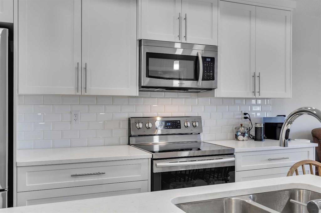 206-370 Harvest Hills Common Ne, Calgary, AB - Indoor Photo Showing Kitchen With Stainless Steel Kitchen With Double Sink With Upgraded Kitchen