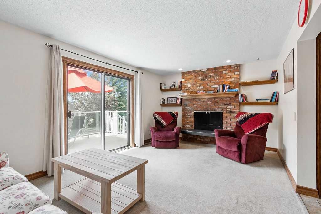 652 Dalmeny Hill Nw, Calgary, AB - Indoor Photo Showing Living Room With Fireplace