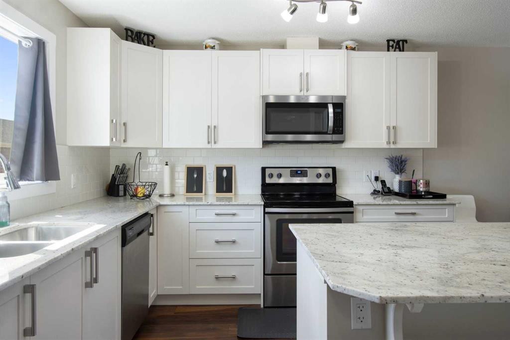 1492 Legacy Circle Se, Calgary, AB - Indoor Photo Showing Kitchen With Stainless Steel Kitchen With Double Sink With Upgraded Kitchen
