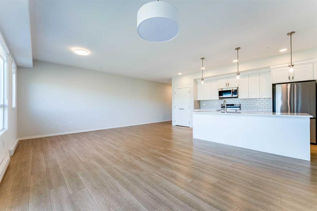 2410-42 Cranbrook Gardens Se, Calgary, AB - Indoor Photo Showing Kitchen With Stainless Steel Kitchen With Upgraded Kitchen