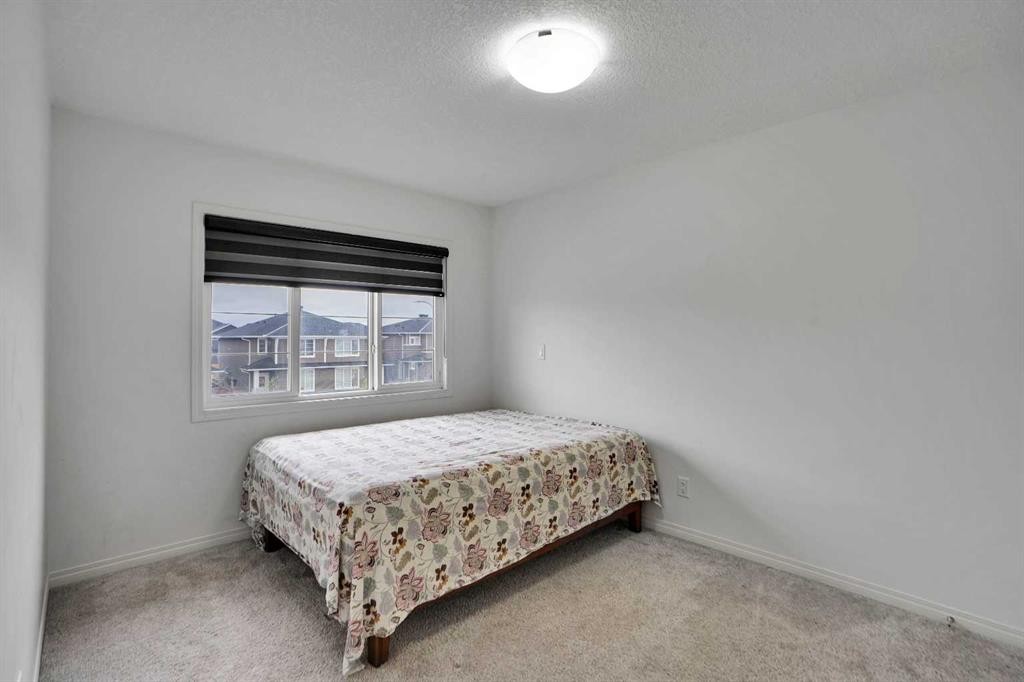 726 Redstone Drive Ne, Calgary, AB - Indoor Photo Showing Bedroom