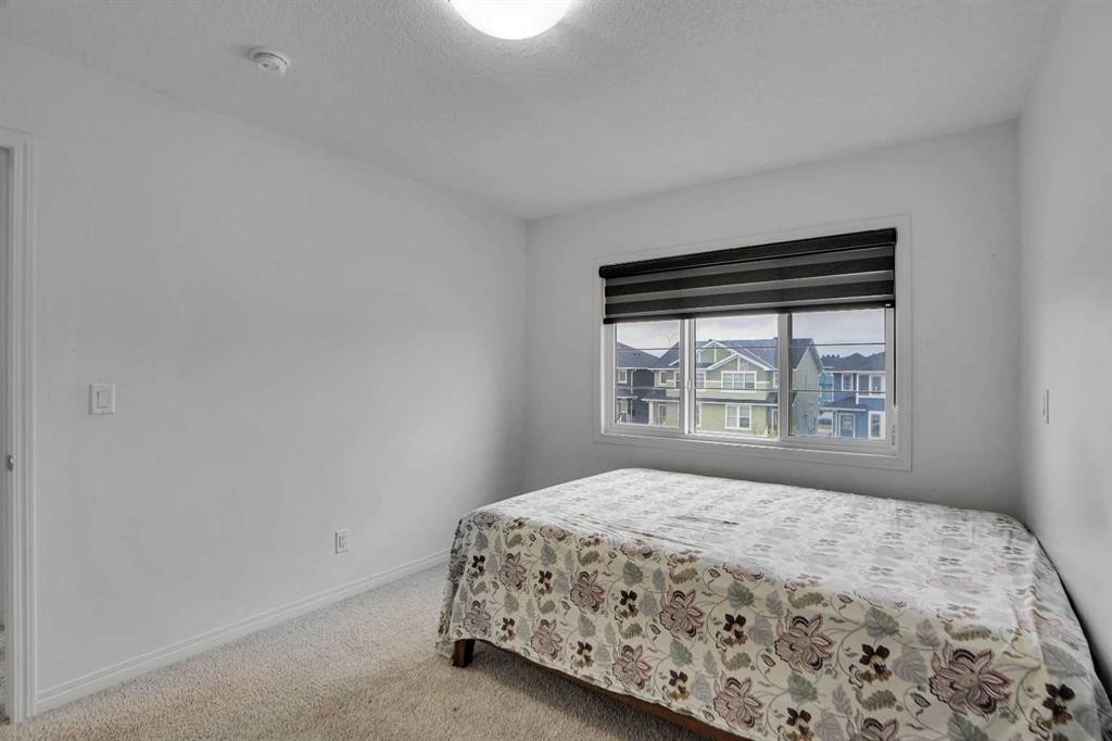 726 Redstone Drive Ne, Calgary, AB - Indoor Photo Showing Bedroom