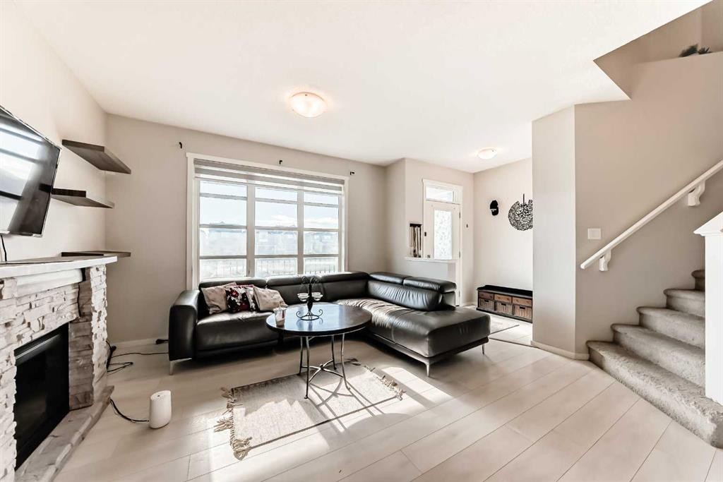 199 Savanna Parade Ne, Calgary, AB - Indoor Photo Showing Living Room With Fireplace