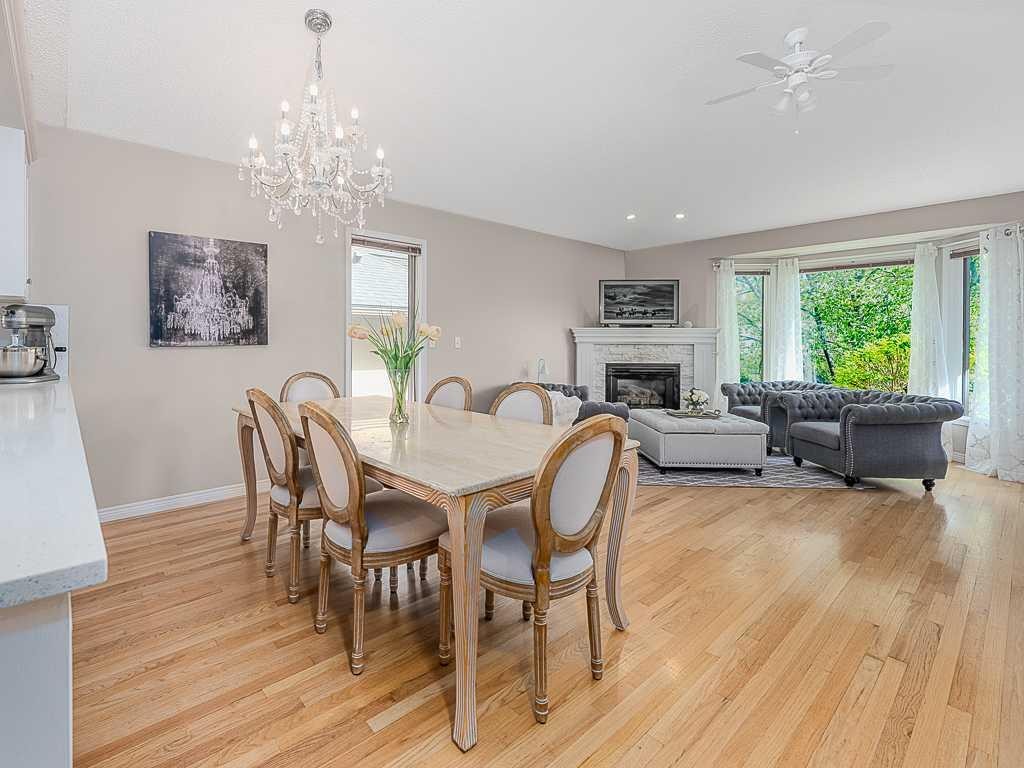 136 24 Avenue Nw, Calgary, AB - Indoor Photo Showing Dining Room With Fireplace