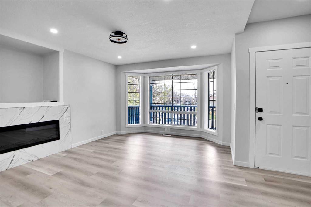 51 Martinridge Grove Ne, Calgary, AB - Indoor Photo Showing Living Room With Fireplace