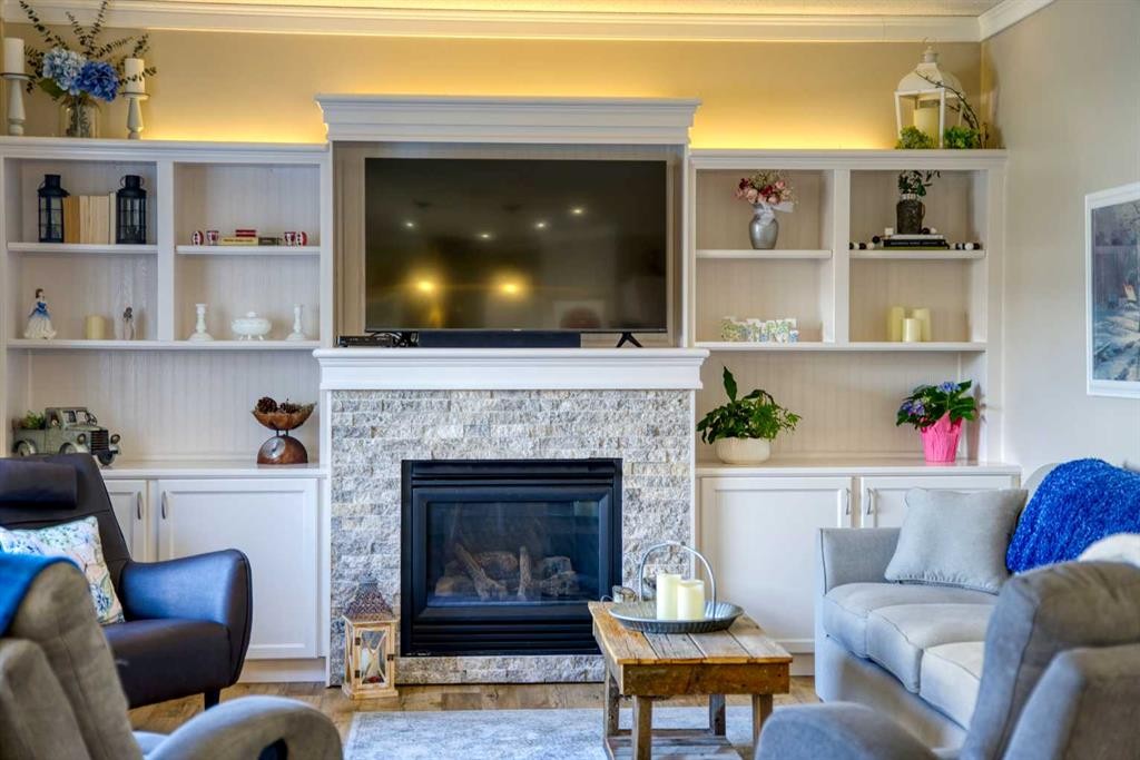 228 Oakmere Place, Chestermere, AB - Indoor Photo Showing Living Room With Fireplace