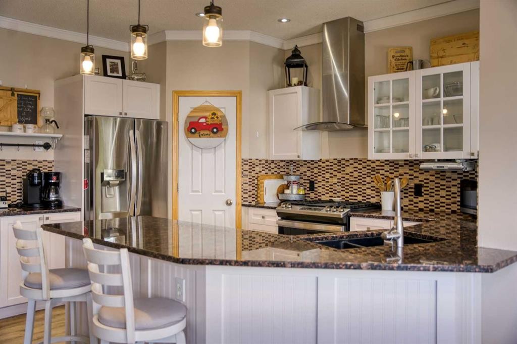 228 Oakmere Place, Chestermere, AB - Indoor Photo Showing Kitchen With Stainless Steel Kitchen With Upgraded Kitchen