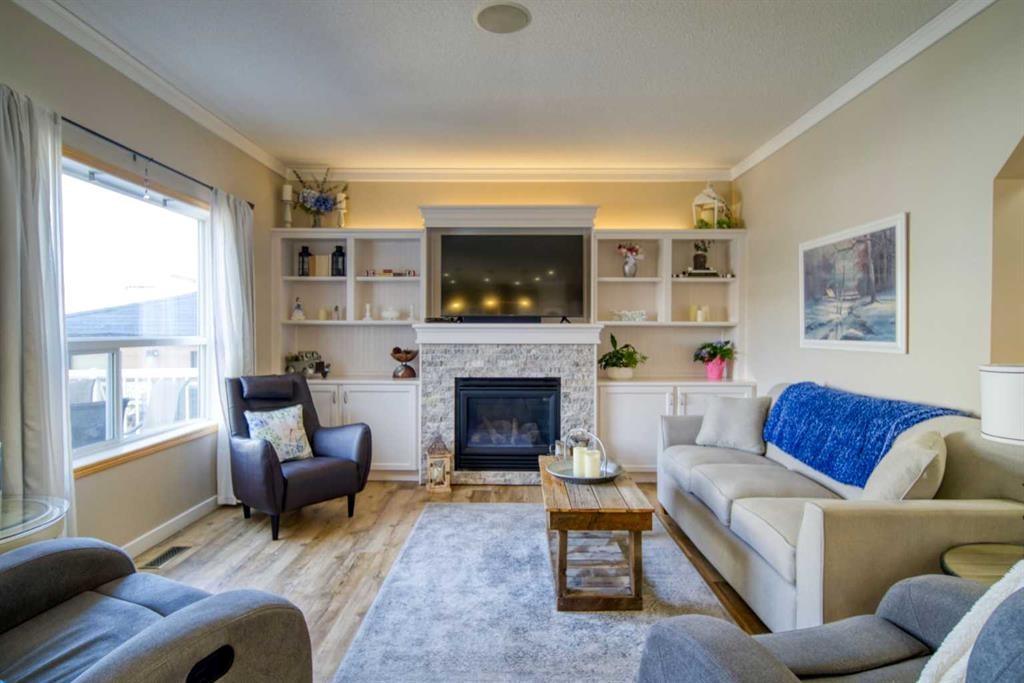 228 Oakmere Place, Chestermere, AB - Indoor Photo Showing Living Room With Fireplace